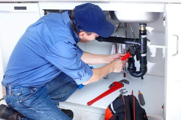a male plumber fixing a toilet from Emergency Plumber Kyle in Kyle, TX  